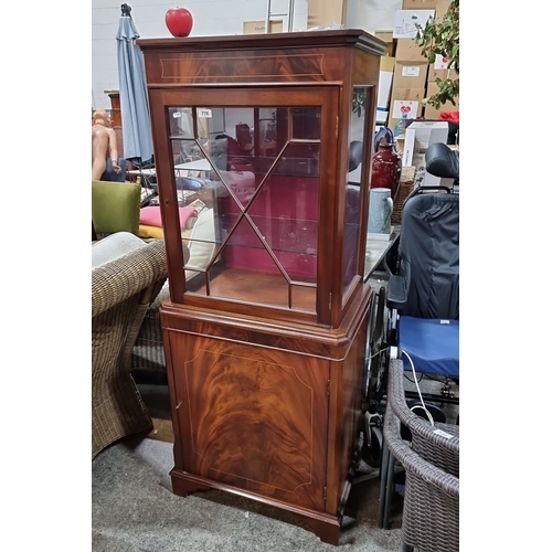 776 - Star Lot : Elegant mahogany display cabinet with glass doors featuring a cross lattice design. Circa... 