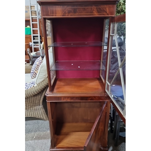 776 - Star Lot : Elegant mahogany display cabinet with glass doors featuring a cross lattice design. Circa... 