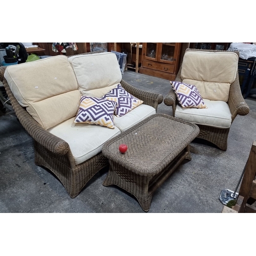 778 - Rattan furniture set including a two-seater sofa, two armchairs, and a coffee table. Features cream ... 