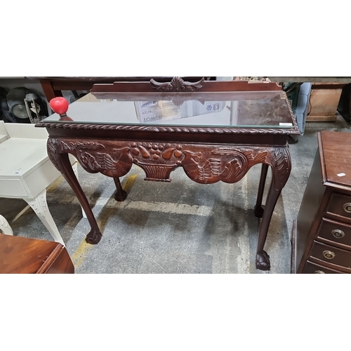 782 - Elegant antique console table featuring intricately carved fruit and foliate motifs with claw-foot l... 