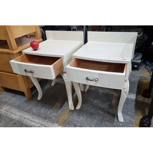 786 - Pair of vintage-style bedside tables featuring elegantly carved legs, single drawers, and antique br... 