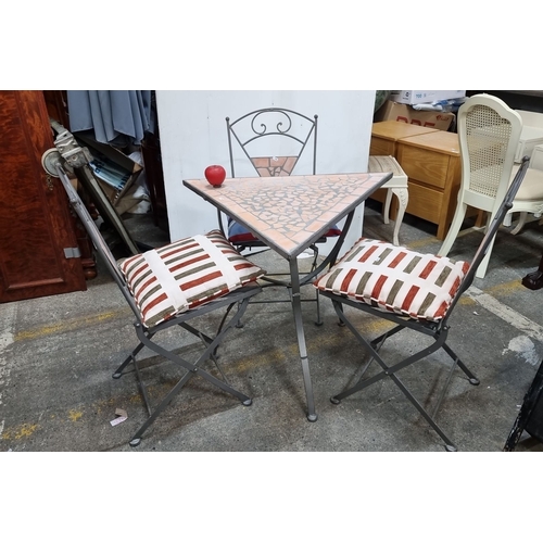 793 - Star Lot : A Charming bistro set featuring a mosaic tabletop with geometric terracotta tiles and thr... 