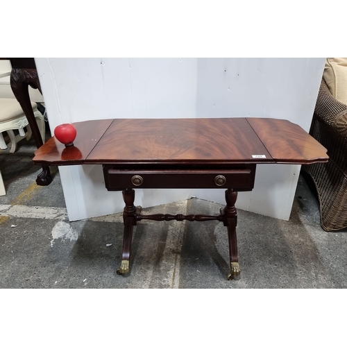 794 - Early 20th-century mahogany drop-leaf table with ornate brass claw feet and a single drawer featurin... 