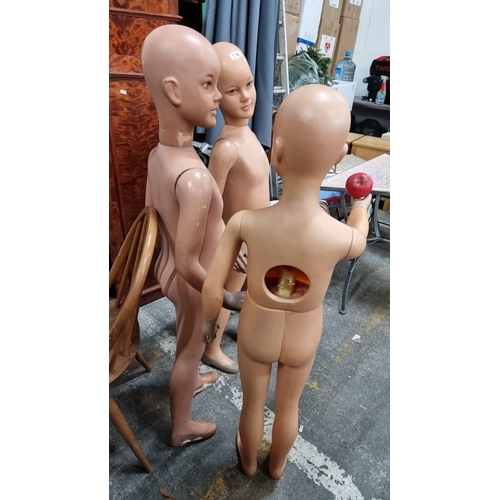 796 - Collection of three vintage child mannequins, featuring articulated limbs and distinct facial expres... 