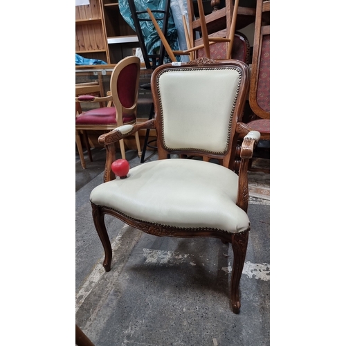 797 - Elegant late Victorian carved oak chair with cream upholstered seating and nailhead trim, in a grace... 