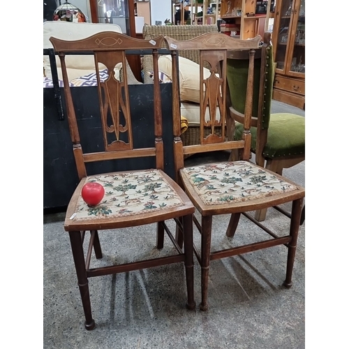 798 - Pair of early 20th century dining chairs with floral upholstered seats and elegant cut-out back desi... 