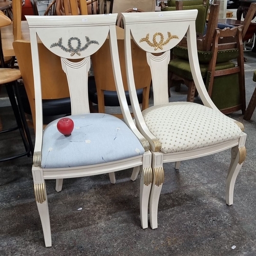 803 - Pair of elegant neoclassical-style chairs with distinctive gold laurel wreath motifs and fluted deta... 