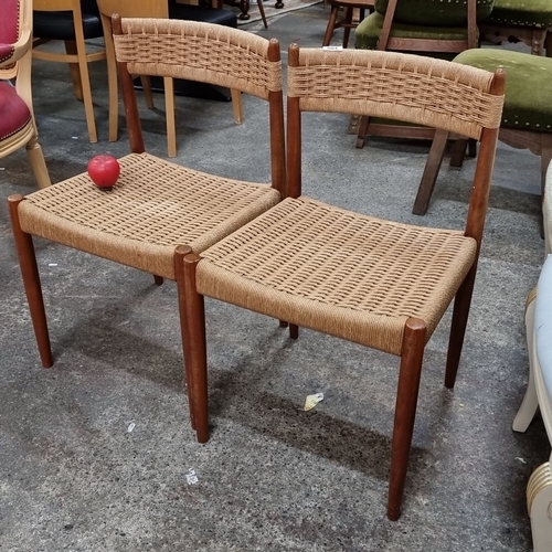 804 - Pair of mid-century modern dining chairs with woven rattan seats and backs, framed in sleek, stained... 