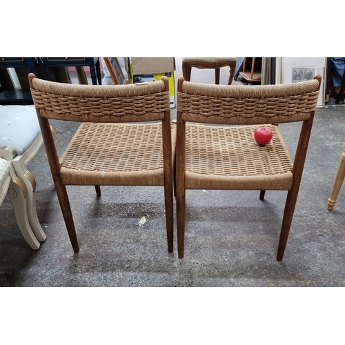 804 - Pair of mid-century modern dining chairs with woven rattan seats and backs, framed in sleek, stained... 