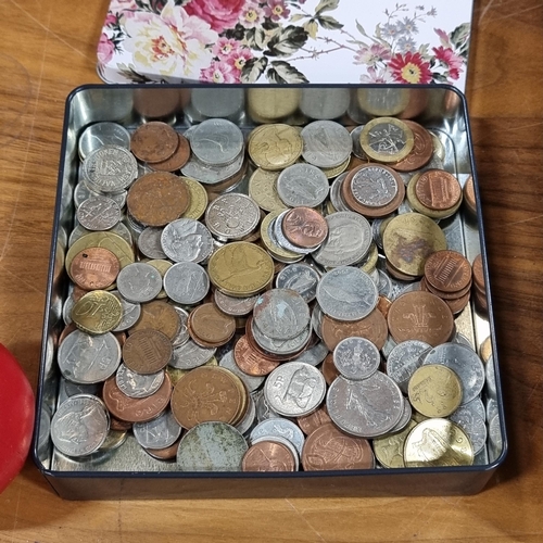 921 - A tin containing a large assortment of unchecked vintage coins including Irish and British examples