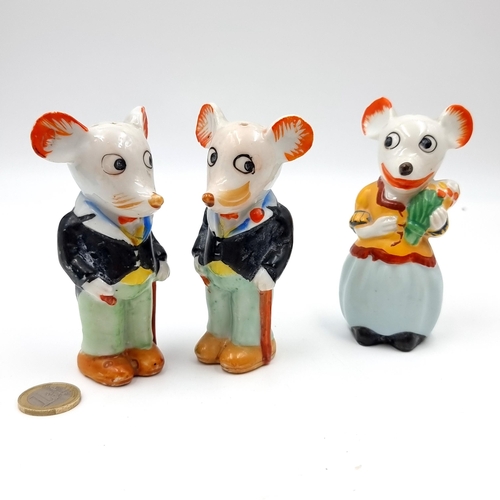 954 - An interesting three piece 'Mickey Mouse & Mini Mouse' cruets set. Dimensions - 10 x 4 cms. Items as... 