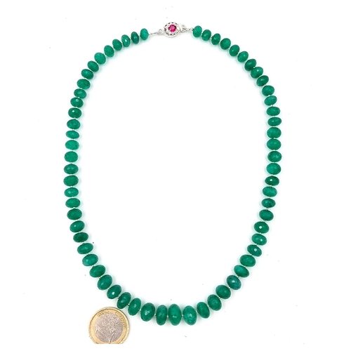 968 - Star Lot : A super example of a graduated emerald gemstone necklace with a ruby stone set clasp set ... 