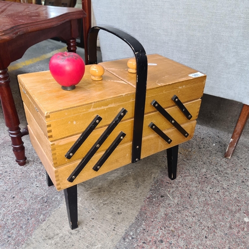 981 - A lovely mid century folding sewing box with hinged lids and tapered legs, nice contrast with the wo... 