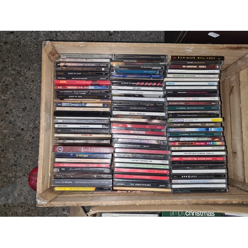 991 - A crate containing a large selection of CD's covering various artists including REM, Kings of Leon a... 