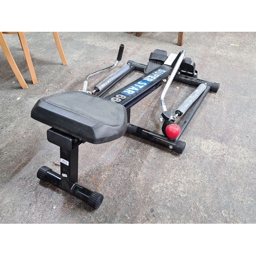 813 - Super Star 660 rowing machine featuring adjustable resistance settings and a comfortable, sliding se... 