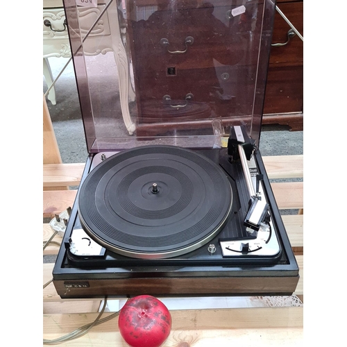 824 - Vintage Dual 1010 Turntable, crafted in Germany, featuring a sleek black design, precision arm, and ... 