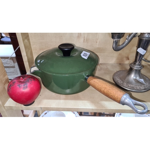 829 - Vintage Le cruset heavy green clean enamel saucepan with wooden handle and pour. A versatile and cha... 