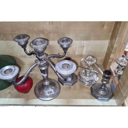 830 - Assortment of six silver-plated candlesticks, featuring elegant engraving and varied designs, suitab... 