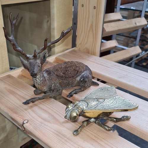 835 - This lot features a pair of intriguing metal animal figurines: one deer and one beetle. The beetle, ... 