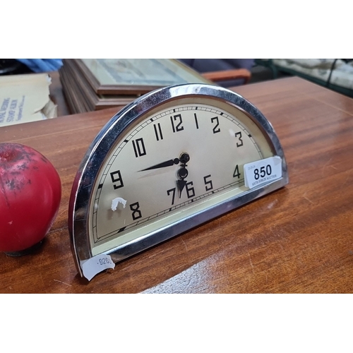 850 - Art Deco style desk clock featuring a curved, chrome frame and classic numerical dial. Ideal for res... 