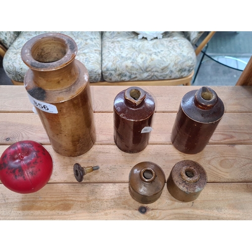 856 - Set of five vintage ceramic stoneware bottles in varying sizes, featuring earthy brown and tan glaze... 