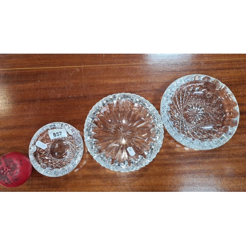 857 - Three heavy crystal ashtrays including a large Waterford crystal example all in good condition.