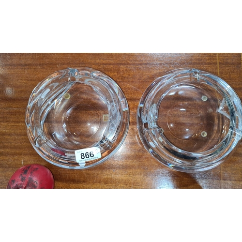 866 - Pair of very heavy crystal ashtrays featuring elegant spiral designs.