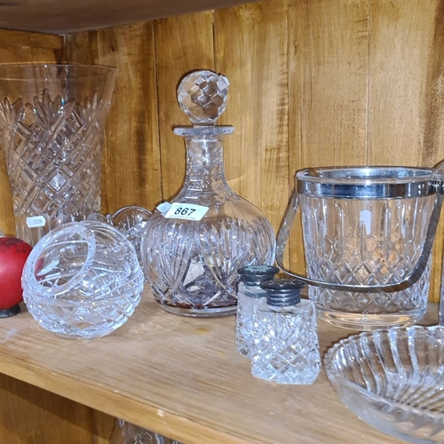 867 - Elegant collection of cut glass crystalware, featuring a decanter, assorted bowls, and serving piece... 