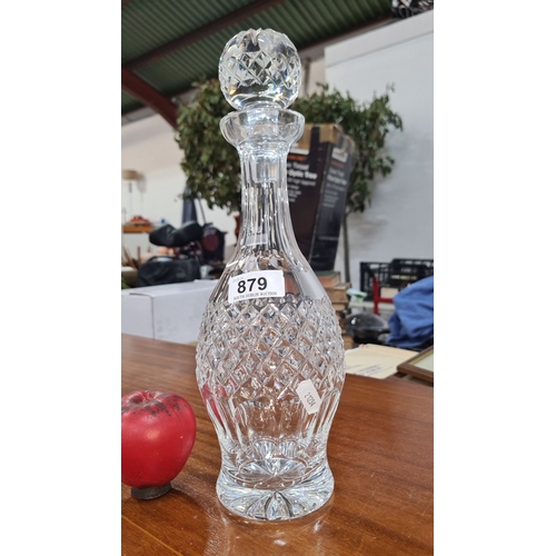 879 - Elegant Waterford crystal decanter with intricate diamond and wedge cut patterns, topped with a face... 