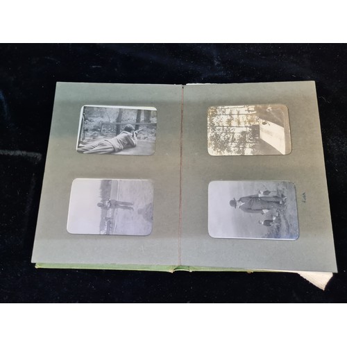 136 - A fabulous antique early 20th century photo album of photographs of families, friends and scenes of ... 