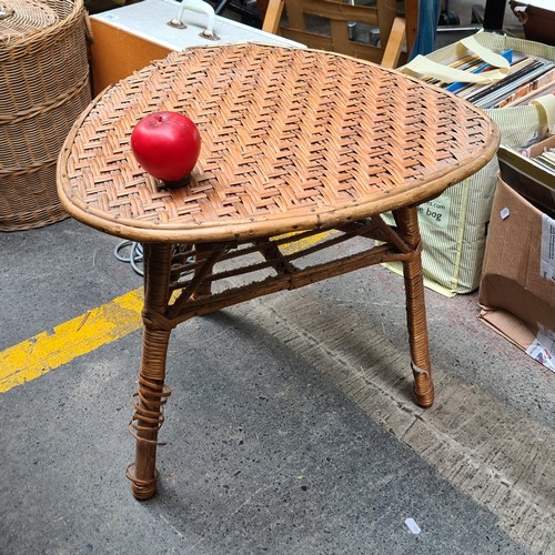 426 - Three bohemian chic household items including a three tier shelving unit, a medium size linen basket... 