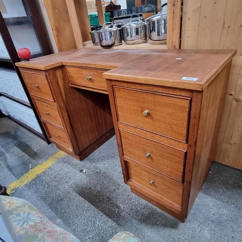 811 - A handsome teak mid century wooden desk with single drawer in the centre and three drawers to each s... 