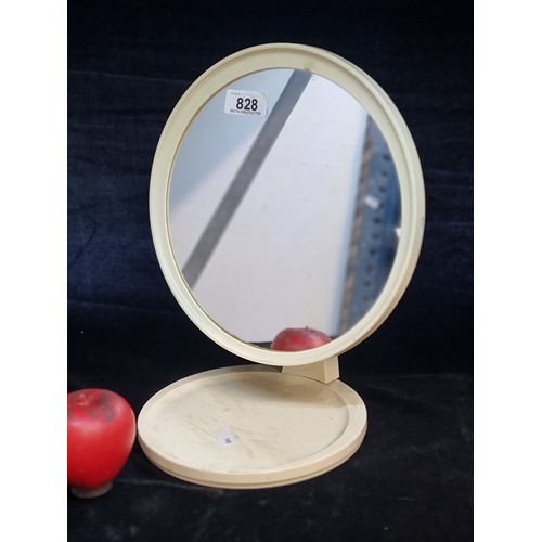 828 - Elegant, free-standing mid century vanity mirror with a minimalist white frame and round reflective ... 