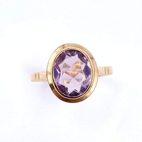 3 - Star Lot : A fabulous nine carat gold (375) Large amethyst  stone ring with circular gold mount. Rin... 