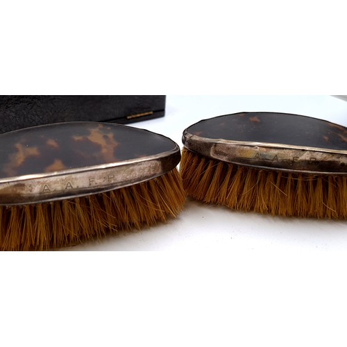 47 - A pair of silver backed tortoise shell clothes brushes. Hallmarked Birmingham - 1927. Items in come ... 