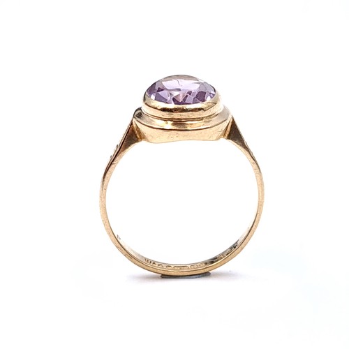 3 - Star Lot : A fabulous nine carat gold (375) Large amethyst  stone ring with circular gold mount. Rin... 