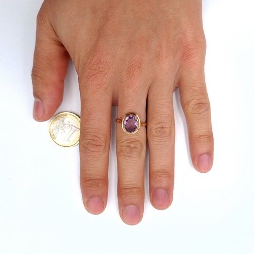 3 - Star Lot : A fabulous nine carat gold (375) Large amethyst  stone ring with circular gold mount. Rin... 