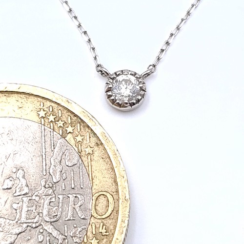 50 - Star Lot : A beautiful diamond pendant marked diamond to reverse. Together with chain marked 10K. Le... 