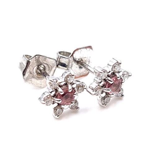 52 - Star Lot : A pair of marked white gold pink tourmaline diamond stud earrings with white diamond surr... 