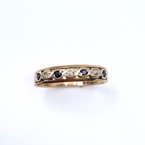 4 - Star lot : A seven stone sapphire and Diamond  half eternity ring set in nine carat gold (375). Ring... 