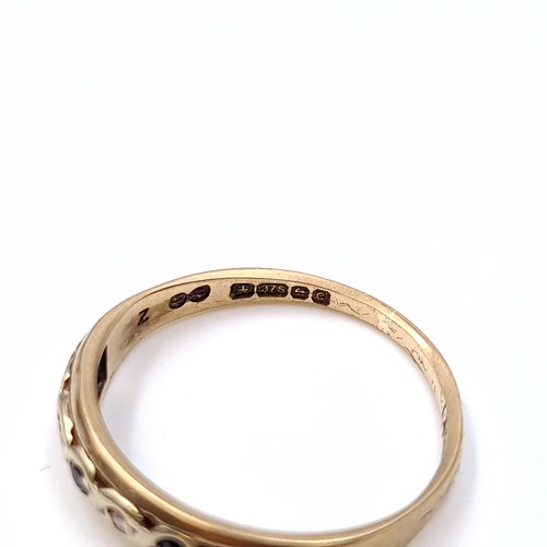 4 - Star lot : A seven stone sapphire and Diamond  half eternity ring set in nine carat gold (375). Ring... 