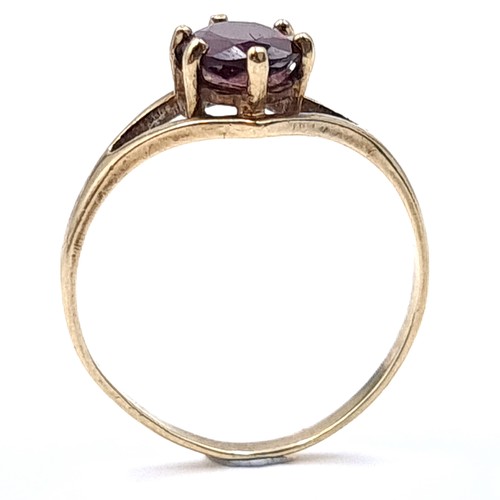 56 - A garnet stone ring set in a claw mount marked nine carat gold (375). Ring size - P. Weight - 1.65 g... 