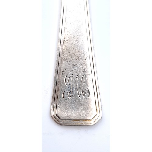 60 - A large sterling silver dinner fork hallmarked London - 1937. Length - 20 cms. Weight - 58.43 grams.