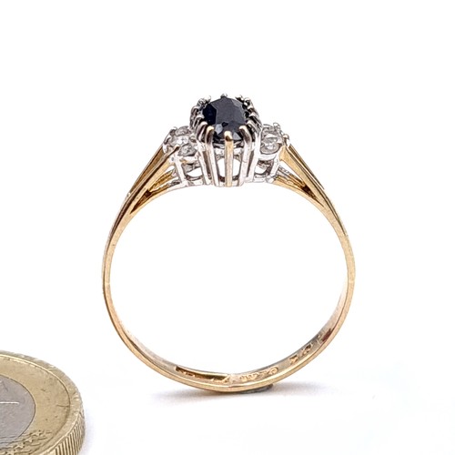 5 - Star Lot : A stunning  arge oval sapphire  ring with gemstone mount set in nine carat gold. Ring siz... 