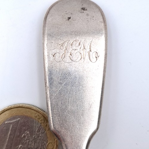 505 - A sterling silver dinner spoon hallmarked London - 1819. Length - 18 cms. Weight - 46.3 grams.