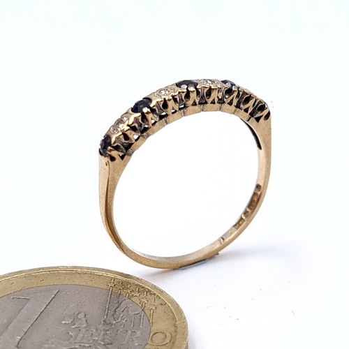 8 - Star Lot : A nine carat gold (375) Sapphire and Diamond eternity ring. Ring size - M. Weight - 1.23 ... 