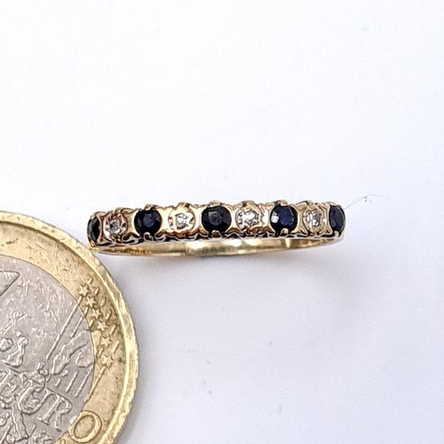 8 - Star Lot : A nine carat gold (375) Sapphire and Diamond eternity ring. Ring size - M. Weight - 1.23 ... 