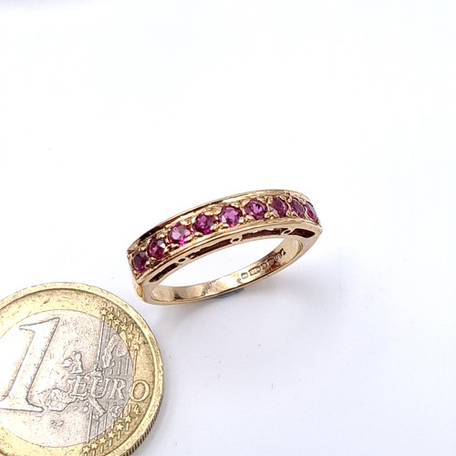 9 - Star Lot : A very pretty nine stone ruby half eternity ring set in nine carat gold (375) Ring size -... 