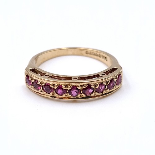 9 - Star Lot : A very pretty nine stone ruby half eternity ring set in nine carat gold (375) Ring size -... 