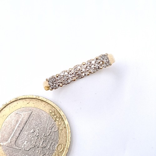 11 - Star Lot : A most attractive 18 carat gold (750) diamond set half eternity ring. Ring size - O. Weig... 